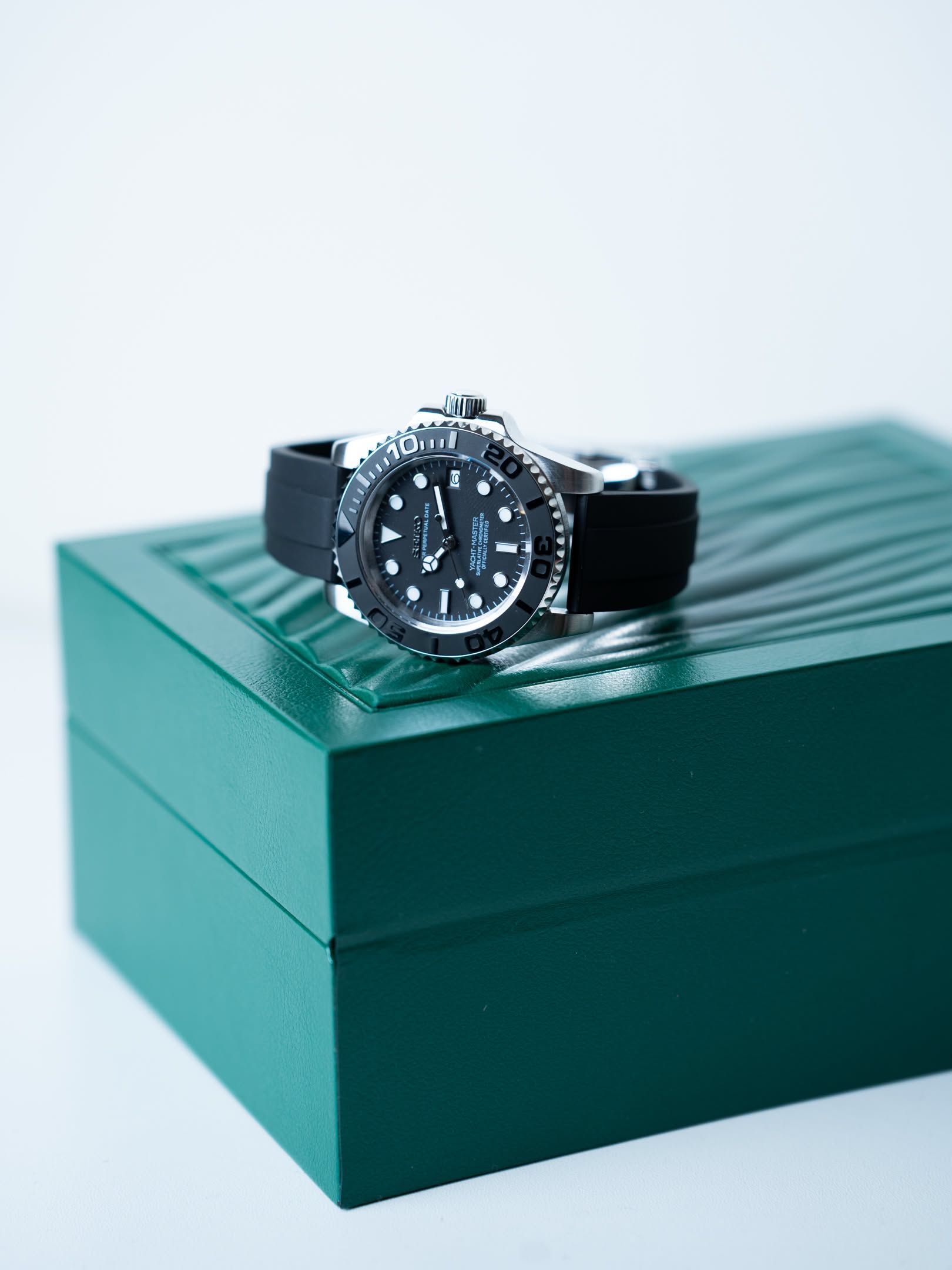 Blackthorn resting on a green watch box.